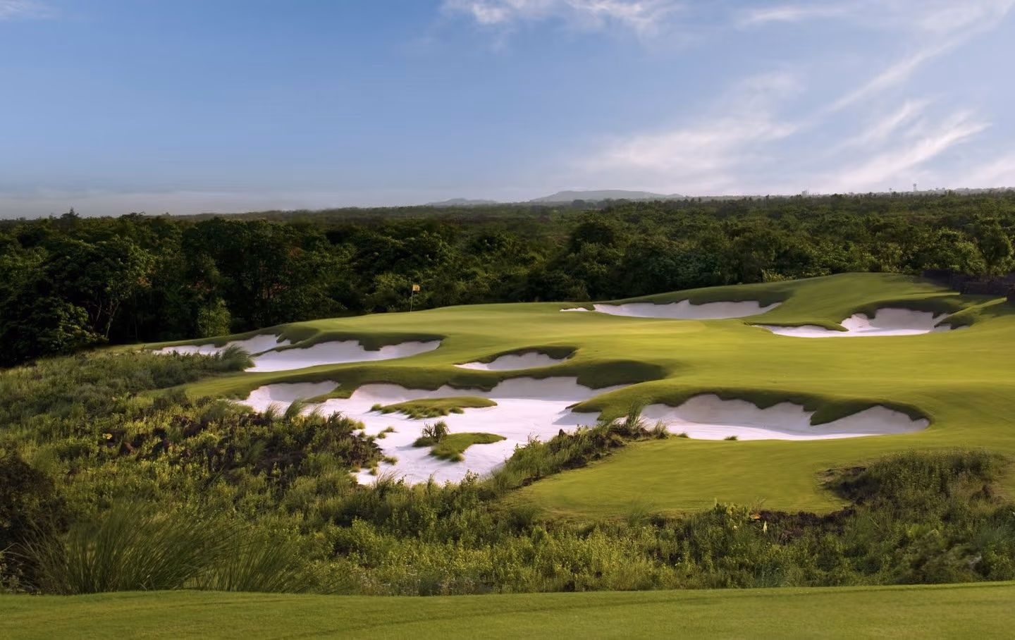 Rugged bunkers across a fairway on the Blackstone course, Haikou