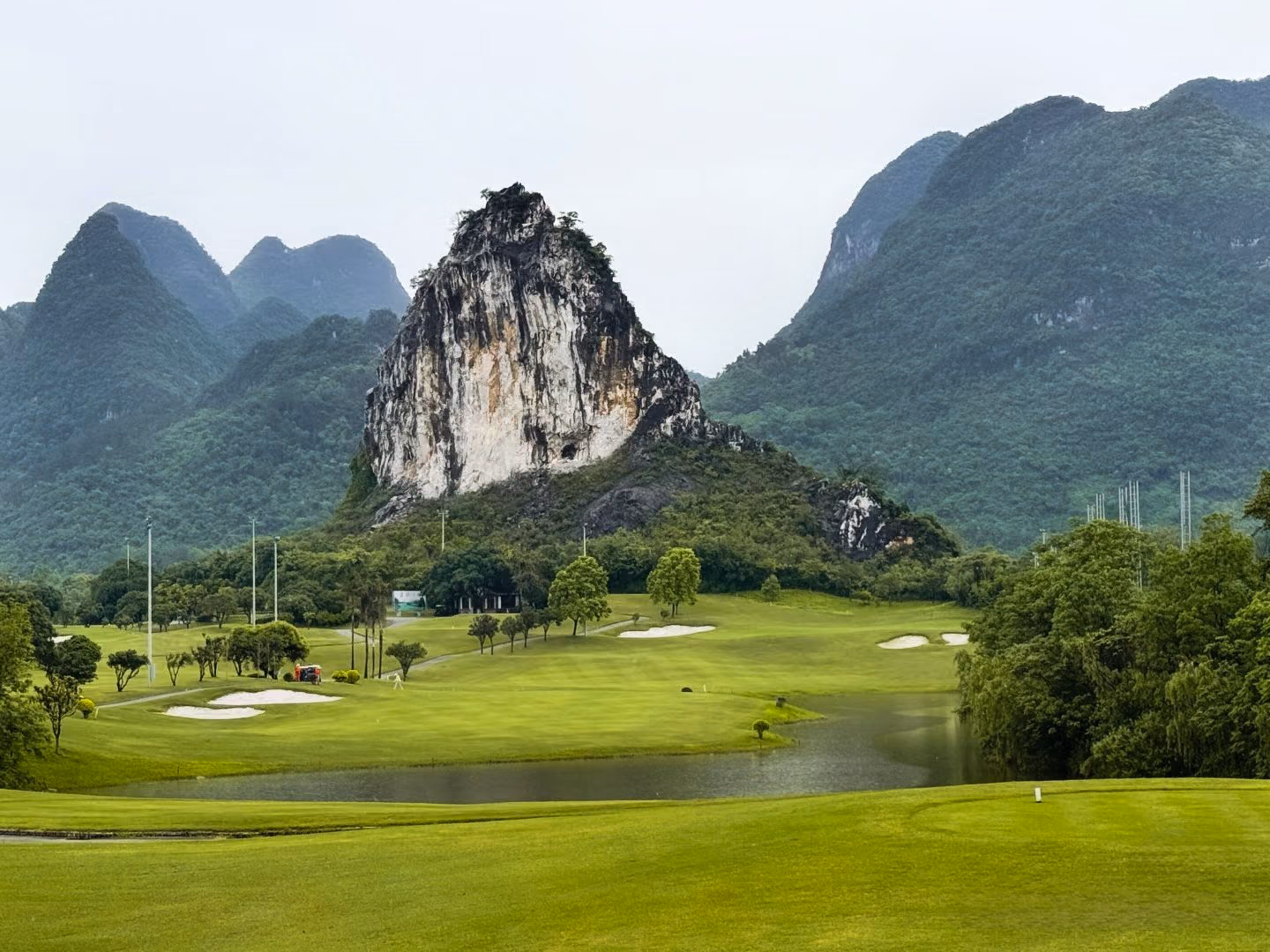 A karst limestone pinnacle rising above the fairways at Guilin Landscape Golf Club