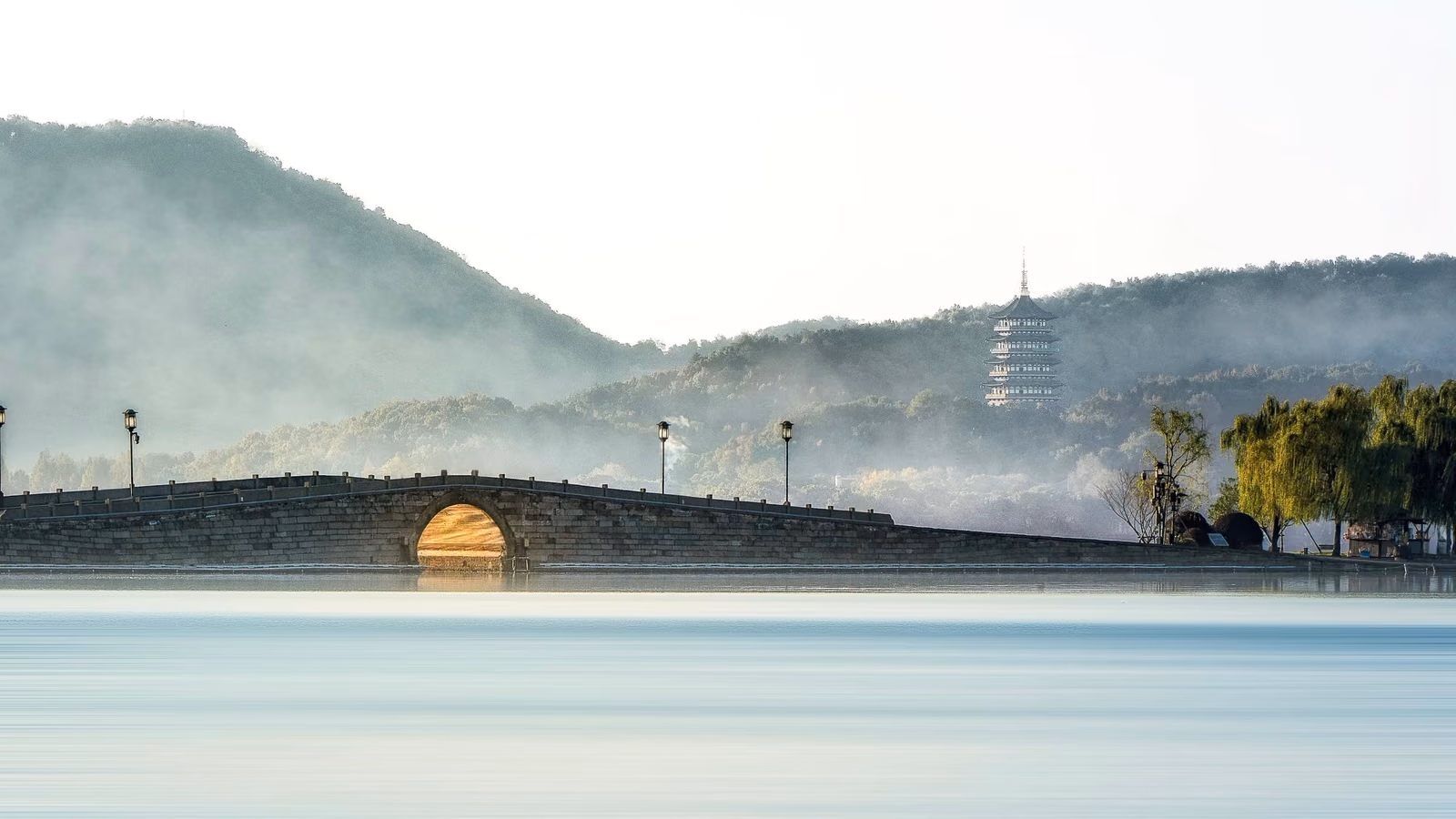 A boat crossing West Lake at dusk, Hangzhou