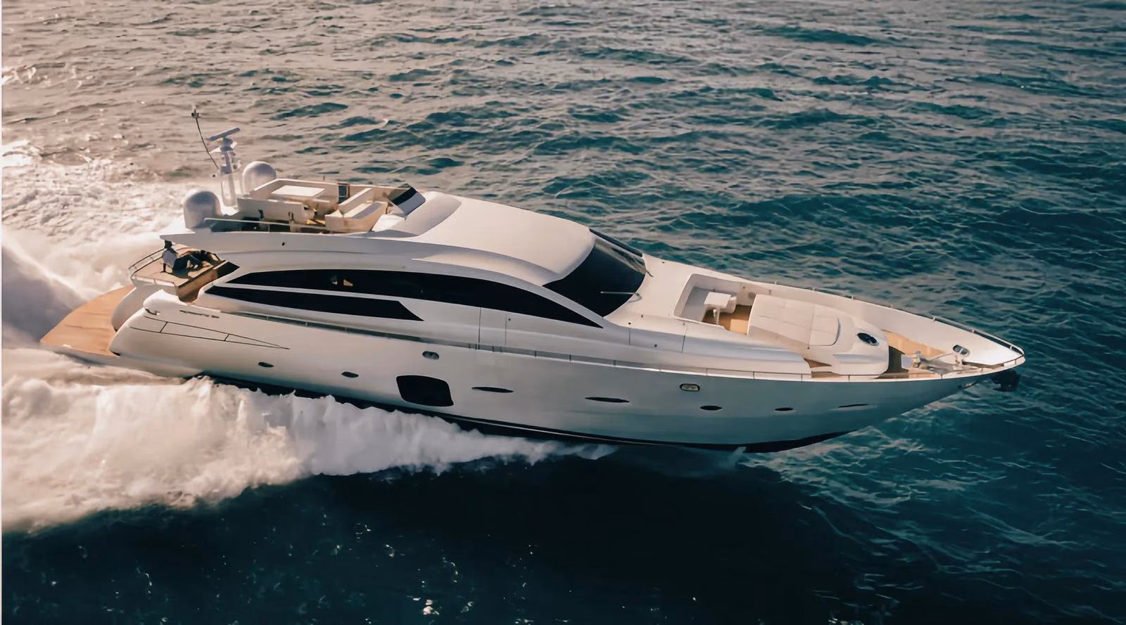 A private yacht cruising the clear water off Sanya