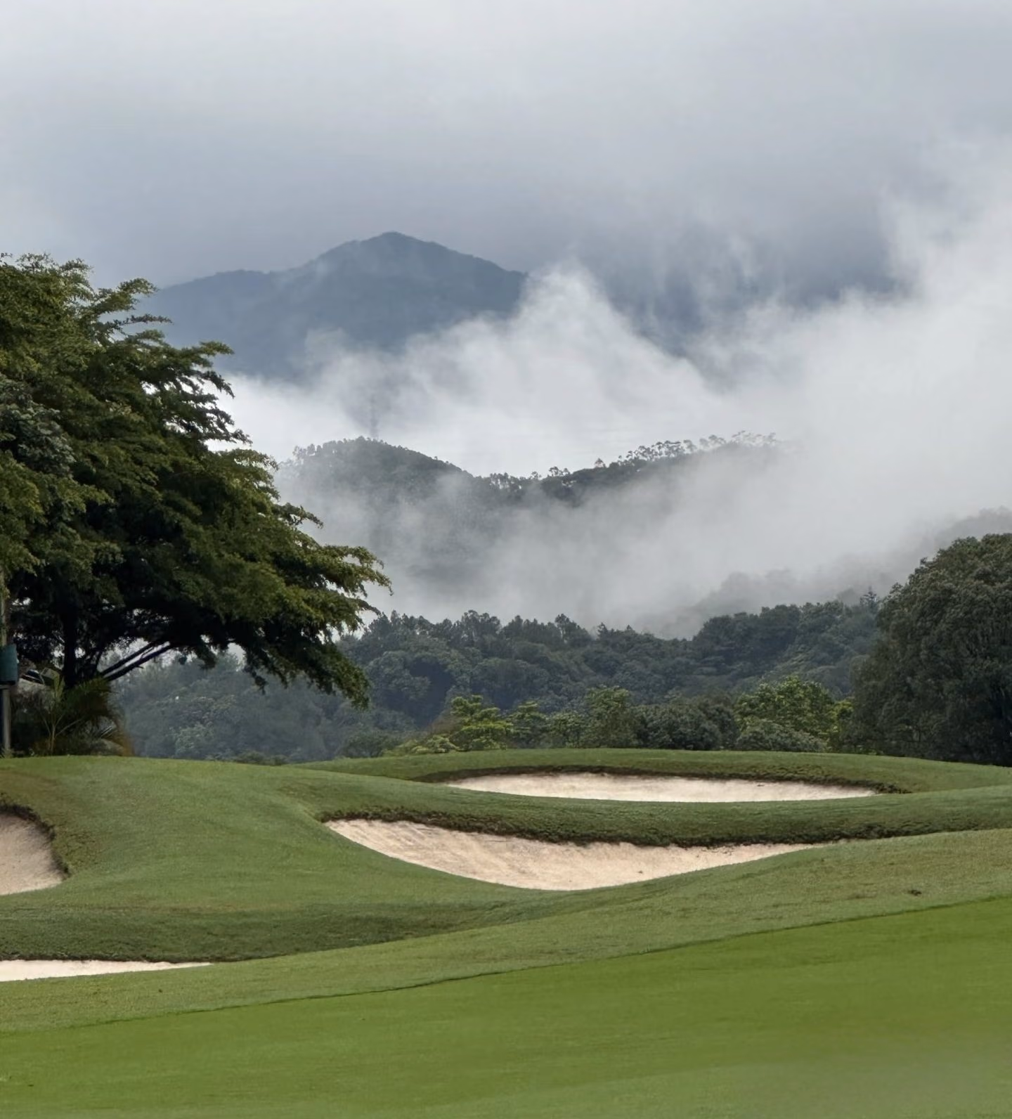 Misty bunkers on the hillside course at Fuchun Golf Club