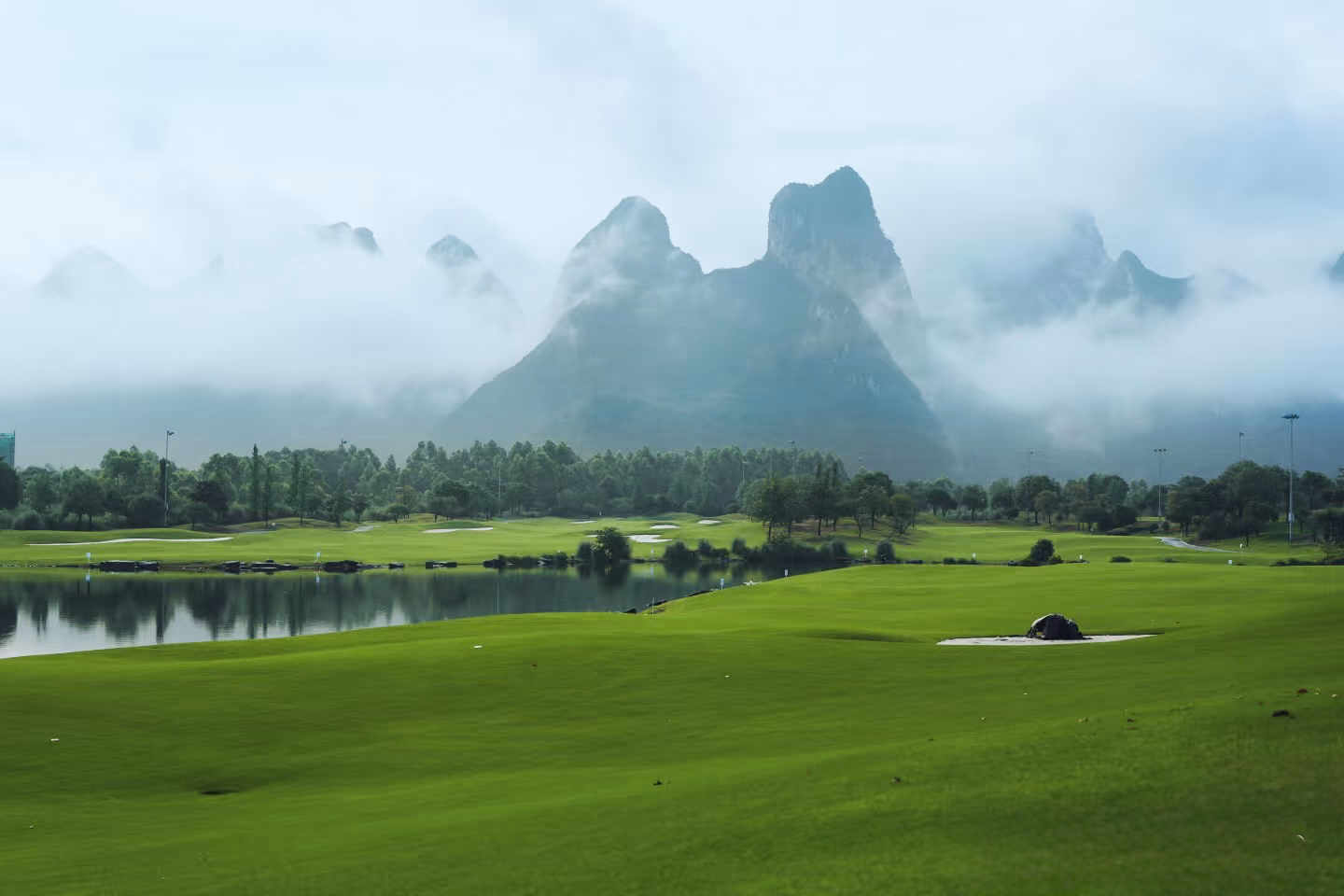 Panorama of karst peaks above the fairways at Guilin Landscape Golf Club