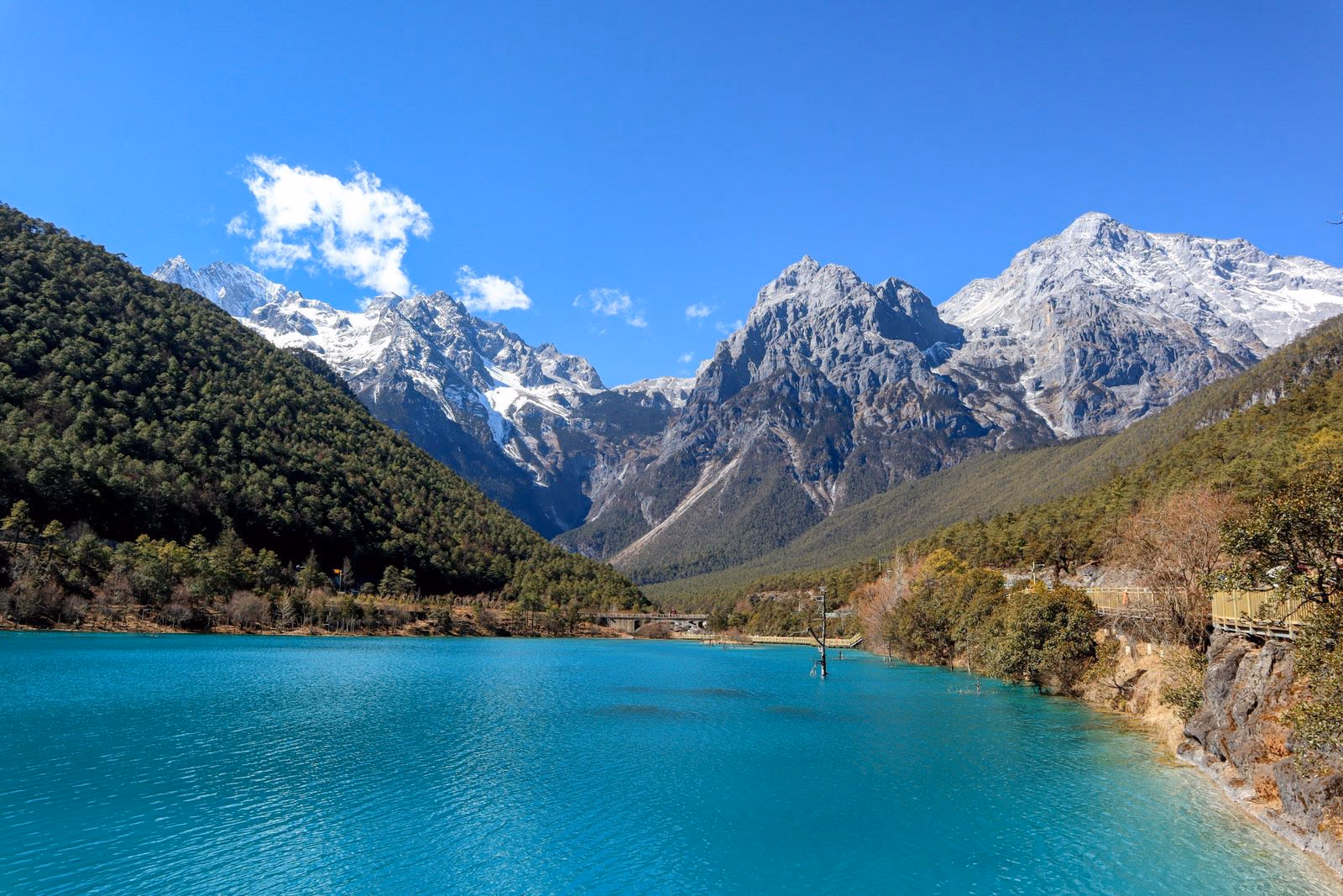 The turquoise water of Blue Moon Valley beneath the snow peaks of Jade Dragon Snow Mountain, Lijiang