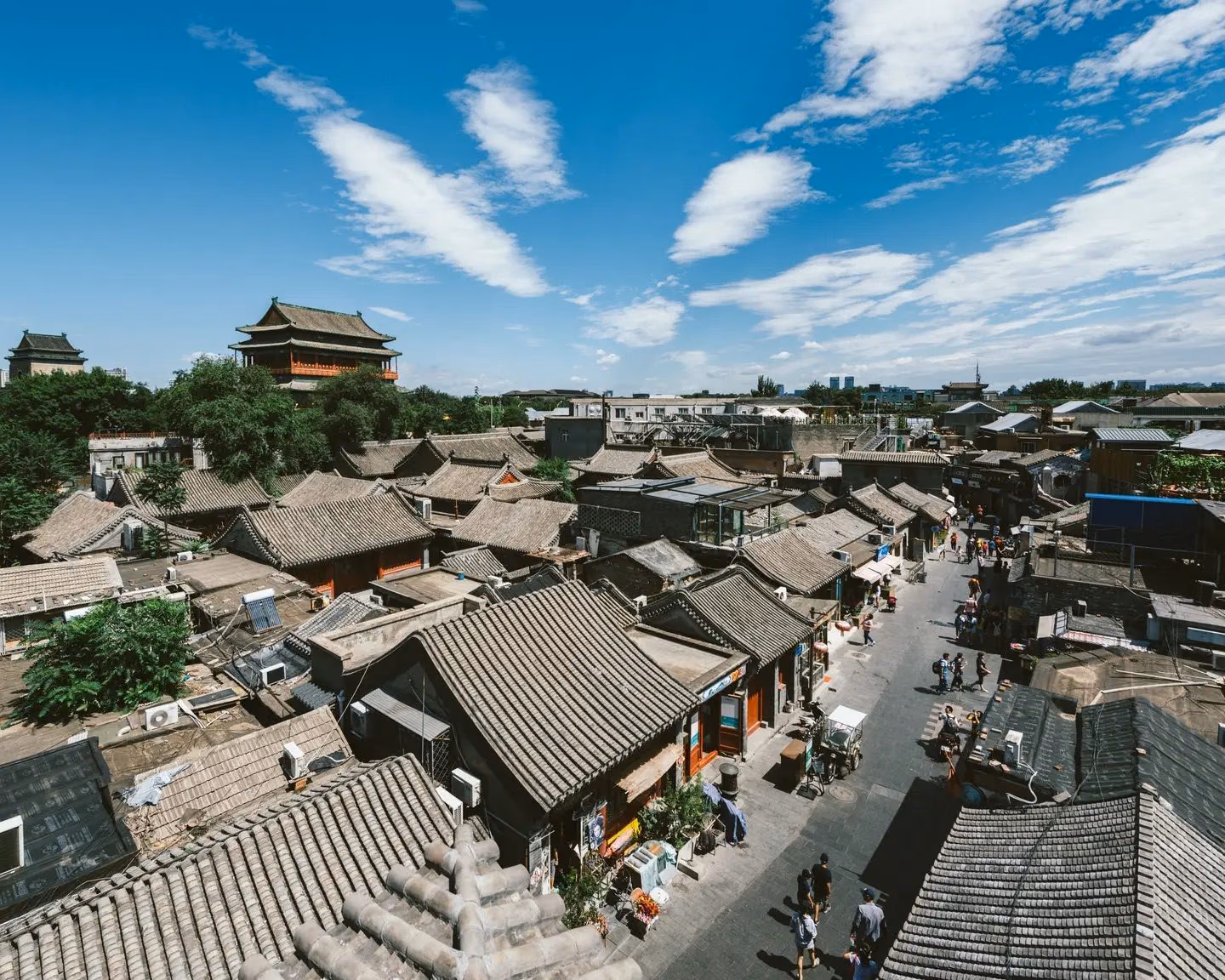 Grey-tiled hutong rooftops stretching toward the Drum Tower, Beijing