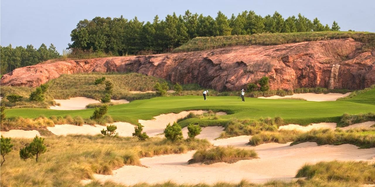 Lion Lake's Moon Course beneath the red sandstone Danxia cliffs, Qingyuan