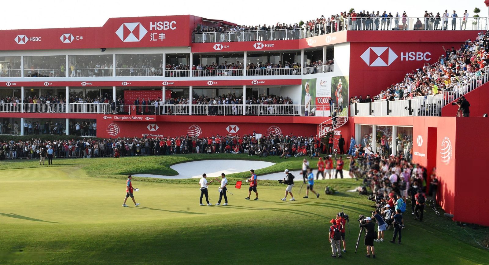 Galleries filling the grandstands around the closing green at Sheshan International