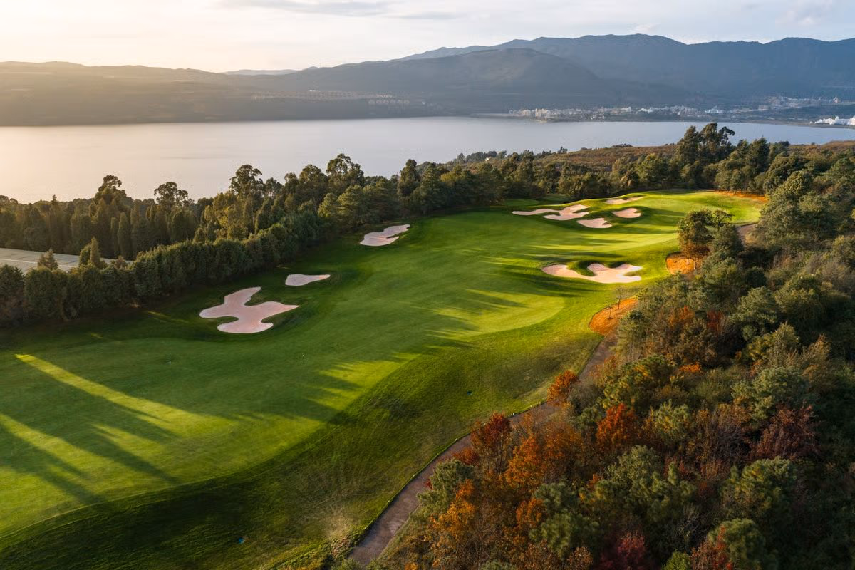 A fairway of Spring City's Mountain Course rolling above Yangzong Lake