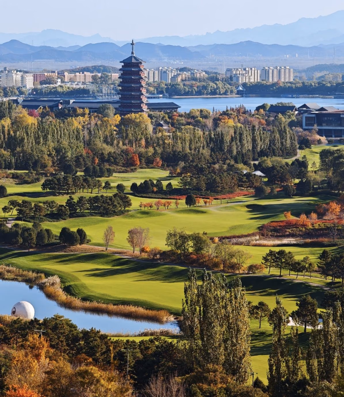 Autumn fairways at Topwin beneath the Yanqi Lake pagoda